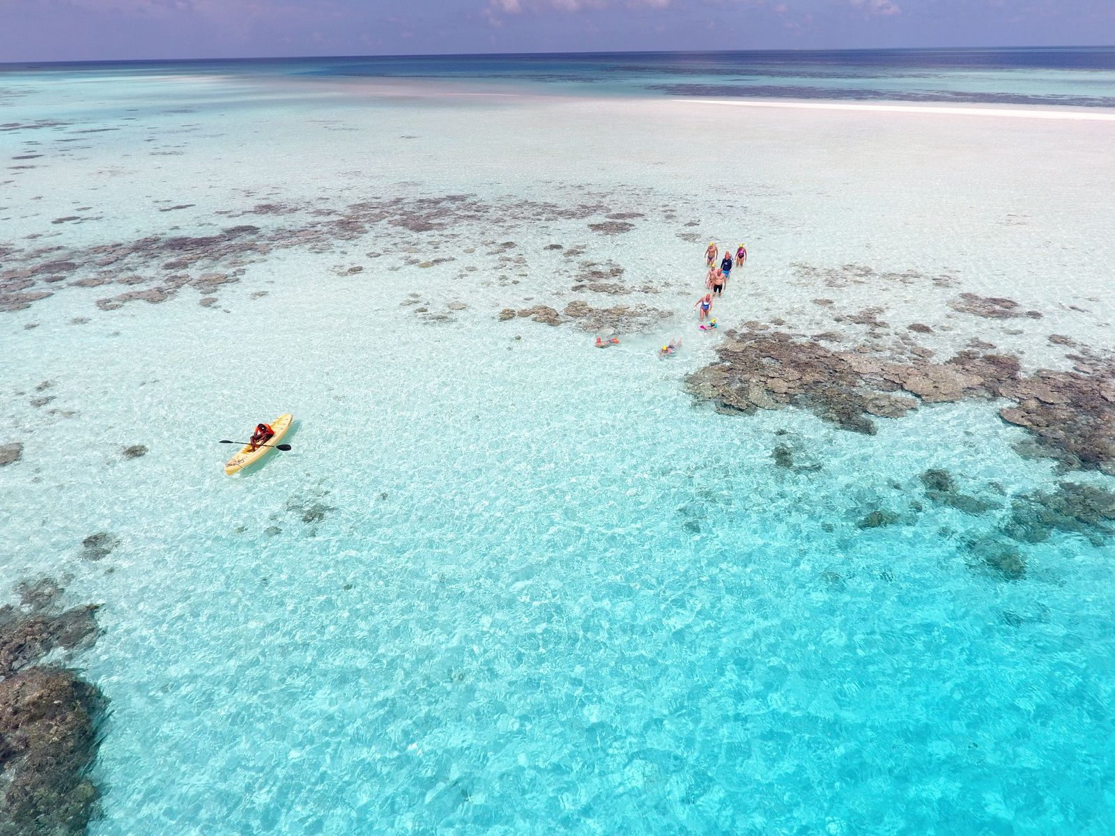 swimming_holidays_maldives_swimmers_walking_ashore
