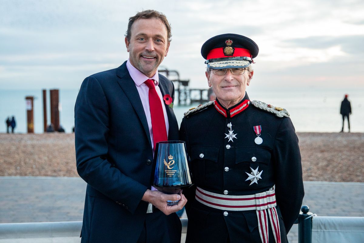 Simon receiving the Queen's award from the Lord Lieutenant of East Sussex
