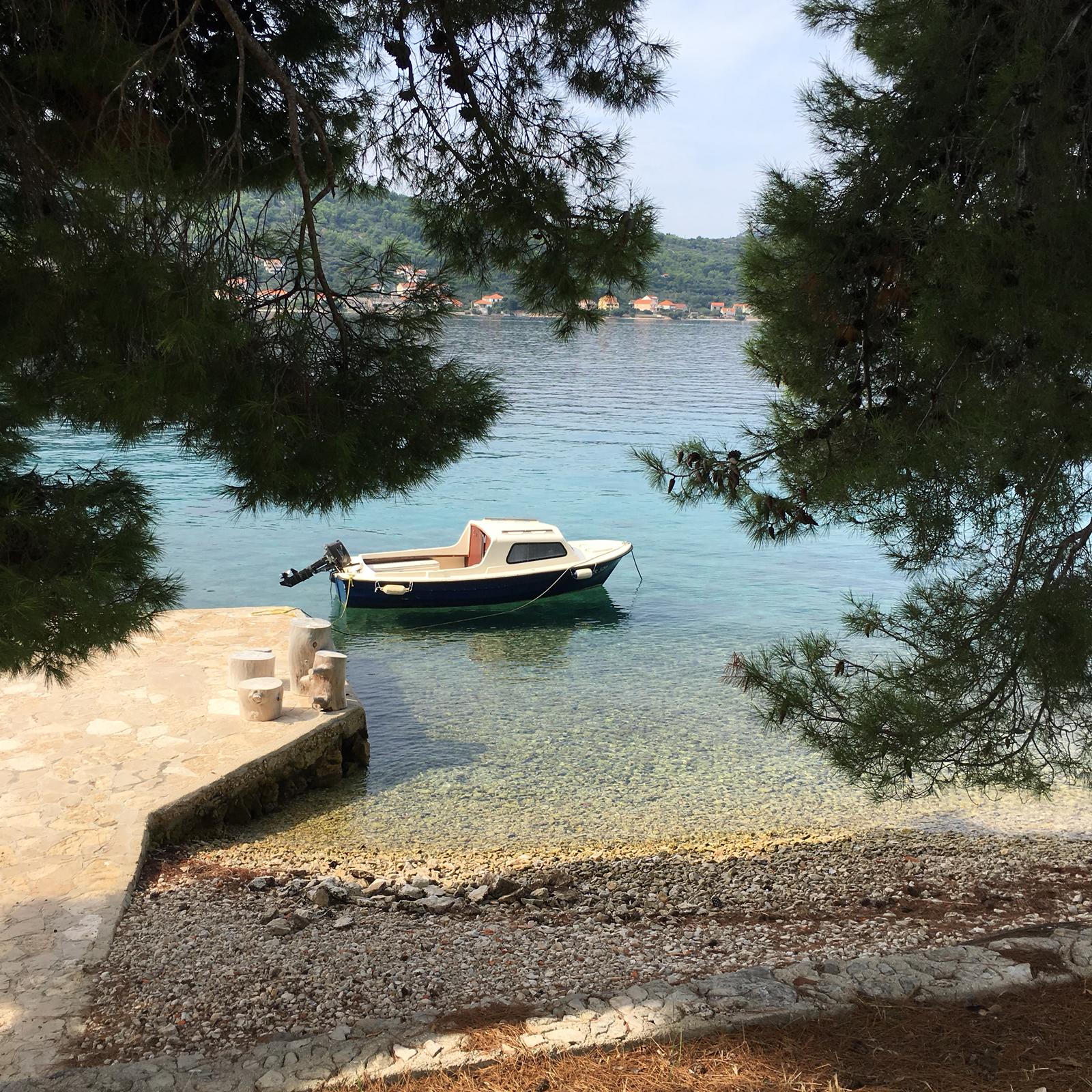 ugljan row boat by shore