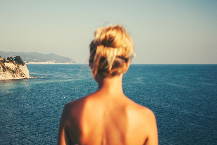 girl looking over water